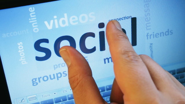 social media and connected words on touch-screen tablet-pc
