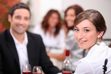 Woman dining with her partner in a restaurant