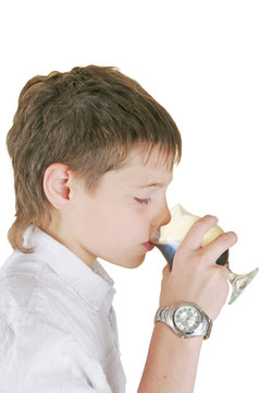 boy drinking a glass of soda