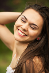 Fototapeta na wymiar Closeup portrait of a beautiful young woman having a happy thoug