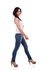 Fototapeta premium wearing white shirt and jeans walking