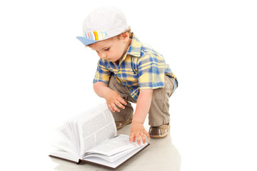 Little boy reading a book