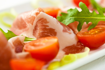 Coppa with cherry tomatoes and arugula