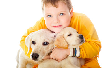 Handsome Young Boy Playing with His Dog Against White Background