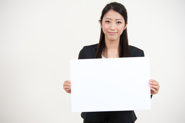 Fototapeta premium a portrait of asian businesswoman with blank whiteboard