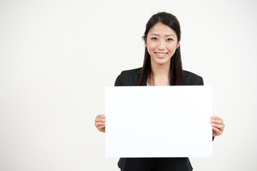 a portrait of asian businesswoman with blank whiteboard