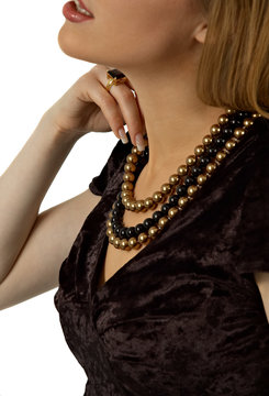 beautiful woman touching her pearl beads