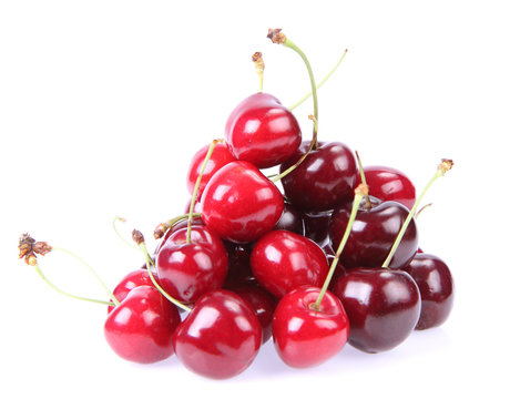 Pile of cherry fruits on a white background
