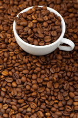 White cup with coffee grains