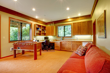 Guest house with kitchen and red sofa