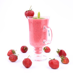Strawberry shake in a glass with strawberries and mint