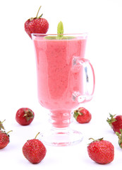 Strawberry shake in a glass with strawberries and mint