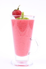 Strawberry shake in a glass with a strawberry and mint