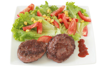Fried hamburgers with salad