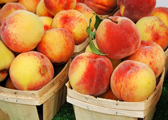 ripe peaches in boxes