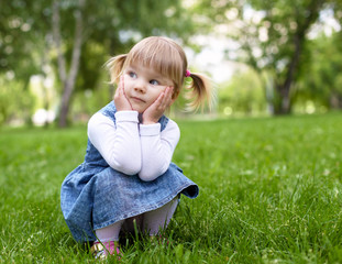 Fototapeta premium Portrait of a little girl outdoors