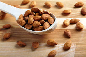 Almonds on wooden background