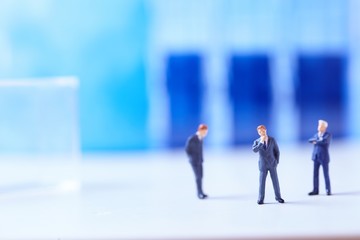 Miniature figurines of successful business team.