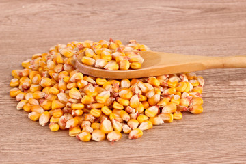 corn and spoon  on brown