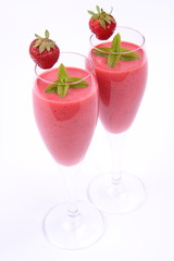 Strawberry shake in champagne glasses with strawberry and mint