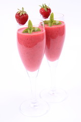 Strawberry shake in champagne glasses with strawberry and mint