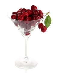 cherries in glass isolated on white background