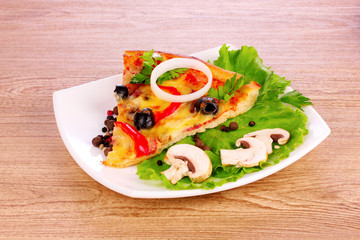 tasty pizza with olives on a wooden background