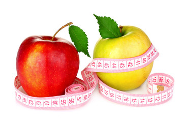 two apples and measuring tape isolated on white