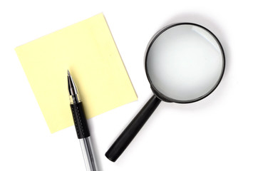Magnifier,pen and notepaper