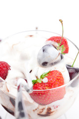 ice cream, cherries, raspberries and strawberries isolated on wh