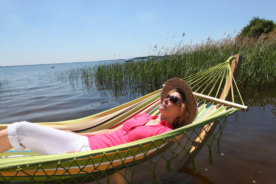 Woman In Hammock By Lake