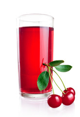 Three ripe cherries with leaves and glass juice isolated on a wh