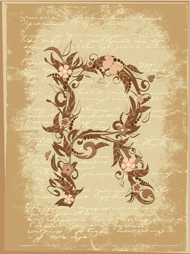 Floral letter on paper grunge