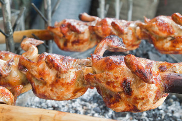 Fresh barbecue chicken on open grill