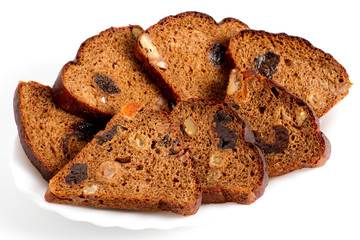 Slices of fruit bread lie on a plate