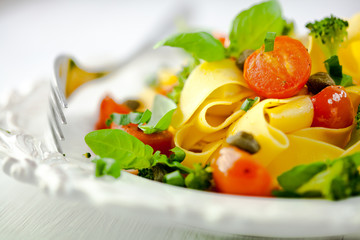 Pappardelle pasta with cherry tomato,capers and broccoli