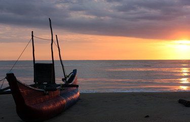 A boat at sunsire in Arugam Bay, Sri Lanka