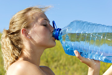 young woman drinking water