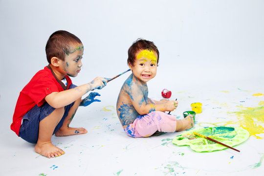 Kids playing with paint