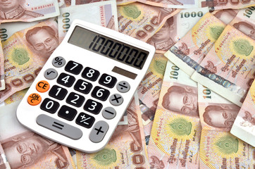 1000 baht banknotes and calculator