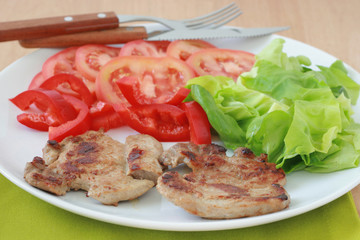 Fried pork with salad