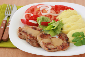 Fried pork with sauce and potato