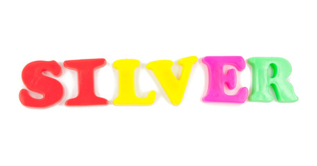 silver written in child's fridge magnets on white