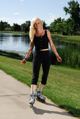 Attractive woman skating at the park