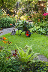 Working with wheelbarrow  in the garden - 33664102