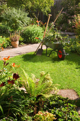 Working with wheelbarrow  in the garden - 33664125