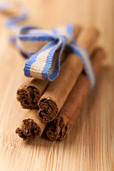 cinnamon sticks on a wood table