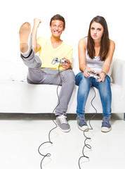 Fototapeta premium Two young people playing a computer game