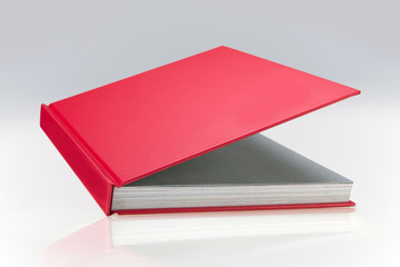 Red book with plain, hard cover