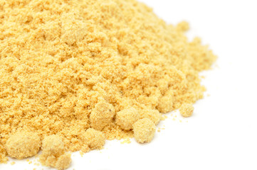 Ground Mustard Close-up on White Background